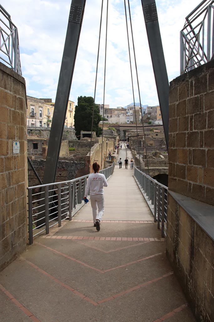 Herculaneum, May 2024.  
Looking north across access bridge towards roadway known as Cardo III Inferiore. 
Photo courtesy of Klaus Heese.